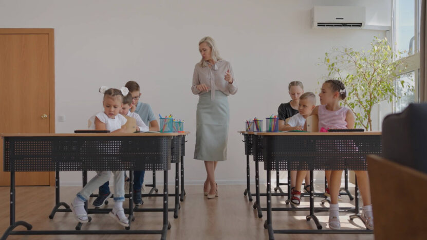 Children and their teacher in the classroom