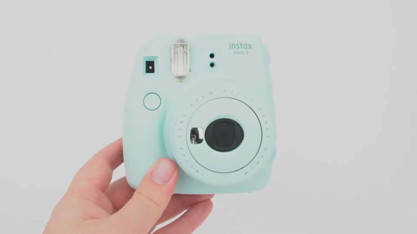 Fujifilm Instax Mini 9 Instant Film Camera in the hand