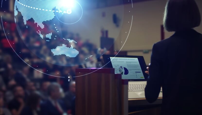 Professor speaking in theater in front of the students