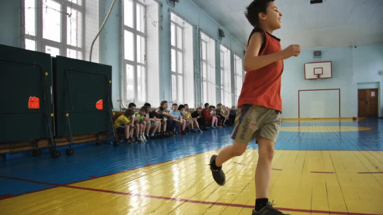 Children are exercising in physical education class