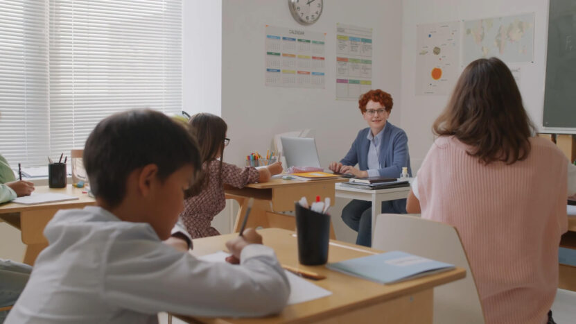 A professor is teaching her students